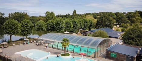 Indoor pool, seasonal outdoor pool, pool umbrellas, pool loungers