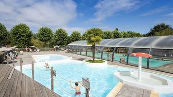 Indoor pool, seasonal outdoor pool, pool umbrellas, pool loungers