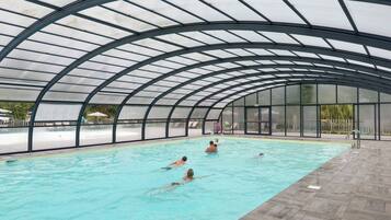 Indoor pool, seasonal outdoor pool, pool umbrellas, pool loungers