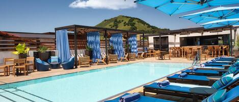 Outdoor pool, open 9:00 AM to 9:00 PM, free cabanas, pool umbrellas