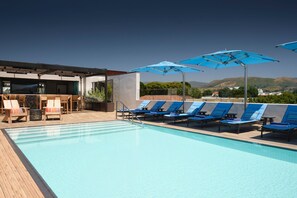Outdoor pool, open 9:00 AM to 9:00 PM, free cabanas, pool umbrellas