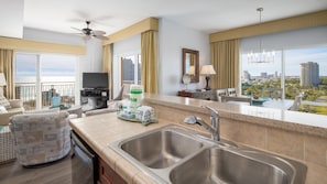 Enjoy a city view from the large balcony, relax in the comfortable seating area, and cook meals in the well-equipped kitchen.
