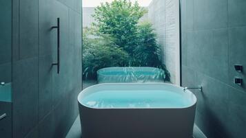 Separate tub and shower, rainfall showerhead, designer toiletries