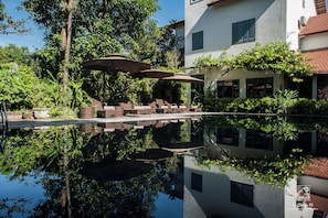 Seasonal outdoor pool, pool umbrellas, pool loungers