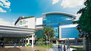 A modern building with a glass facade and a sign reading "City Square Mall". - K Space Inn 569 - Hostel (Singapore)