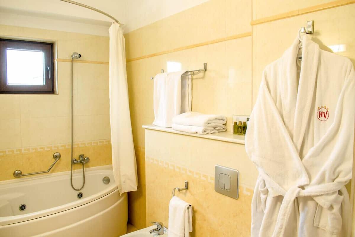 jetted bath, free toiletries, hair dryer, bathrobes