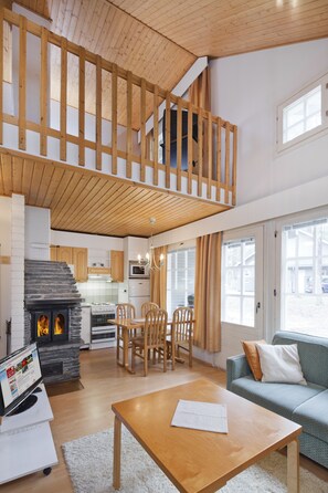 Apartment, Sauna, Mezzanine (30 m2) | Living area | Flat-screen TV, fireplace, DVD player - Holiday Club Kalajoki Cottages (Kalajoki)