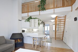 Apartment, 1 Bedroom, Sauna, Mezzanine (47 m2) | Living area | Flat-screen TV, fireplace, DVD player