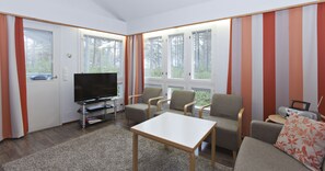 Apartment, 2 Bedrooms, Sauna, Mezzanine (69 m2) | Living area | Flat-screen TV, fireplace, DVD player - Holiday Club Kalajoki Cottages (Kalajoki)