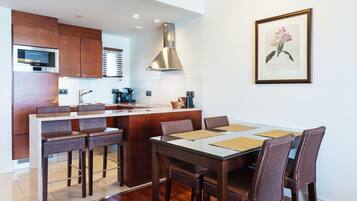 Fridge, microwave, cleaning supplies