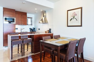 Fridge, microwave, cleaning supplies