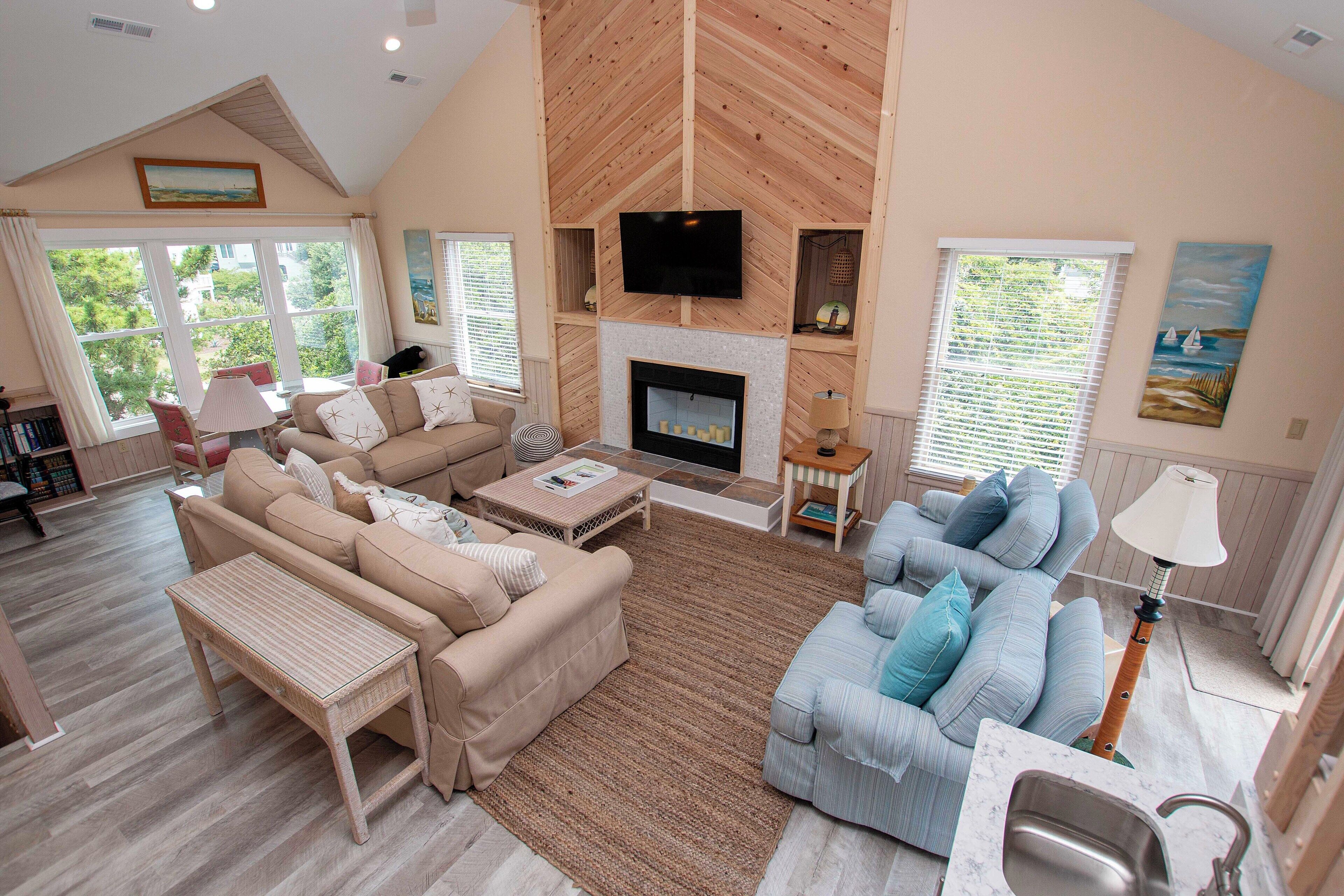 TV, fireplace, books