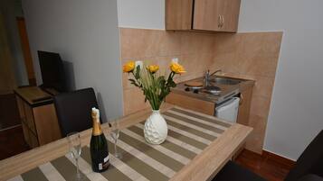 Fridge, electric kettle, cookware/dishes/utensils