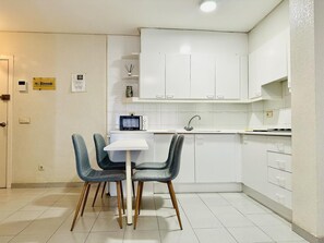 Fridge, microwave, coffee/tea maker, cookware/dishes/utensils