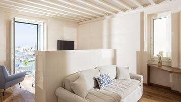 Executive Quadruple Room, Balcony, Harbor View (Le Sciale) | Living area | Flat-screen TV