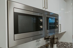 Shared fridge, microwave, espresso maker, coffee/tea maker