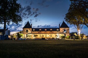 A large, two-story building with a symmetrical roofline, multiple windows, and a central entrance. - Domaine St Ferreol (Chis)
