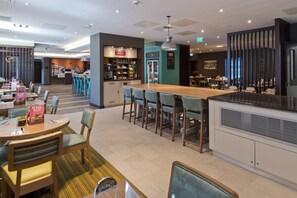 A modern restaurant with a bar area, seating arrangements, and a visible Costa coffee station. - Premier Inn Sevenoaks (Sevenoaks)