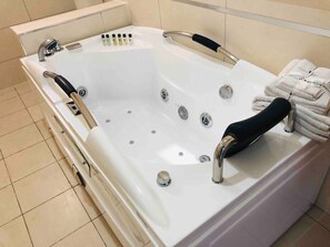 Bathtub, hair dryer, towels