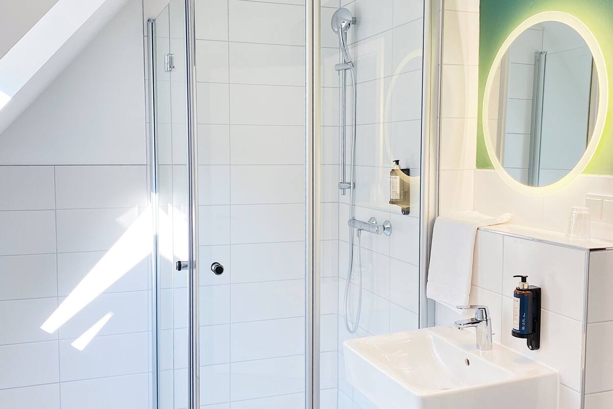 quadruple room | bathroom | shower, hair dryer, towels, soap