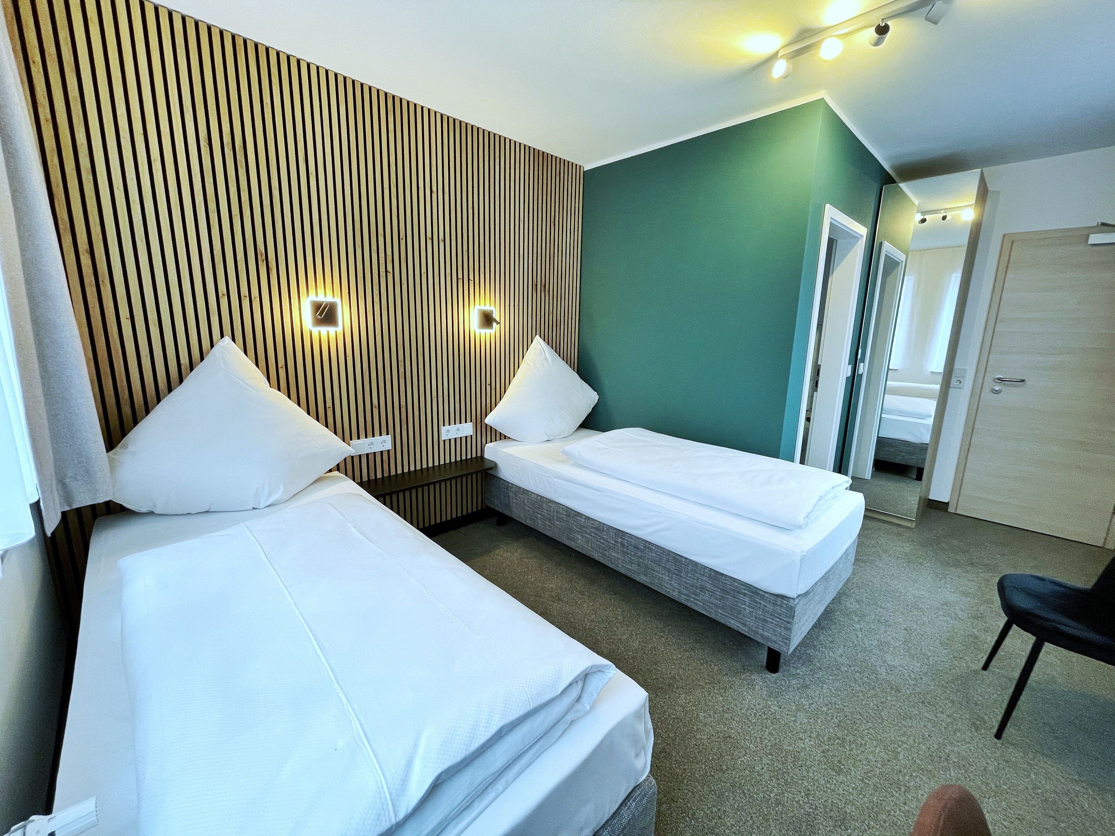 twin room | minibar, in-room safe, desk, blackout curtains