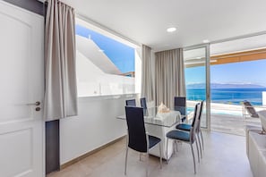 Enjoy breathtaking views of the sea and mountains from the outdoor terrace.