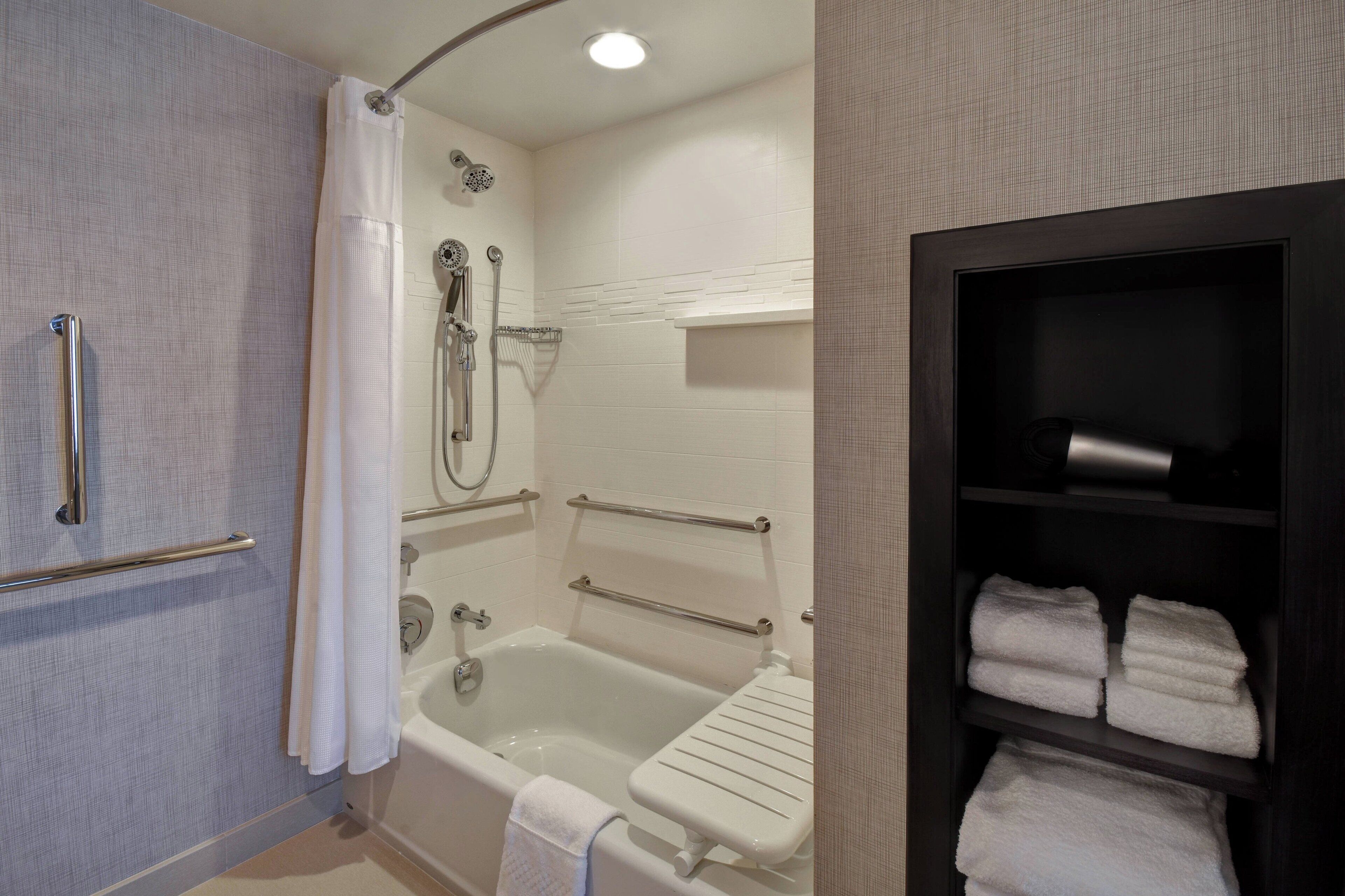 rainfall showerhead, hair dryer, towels, soap