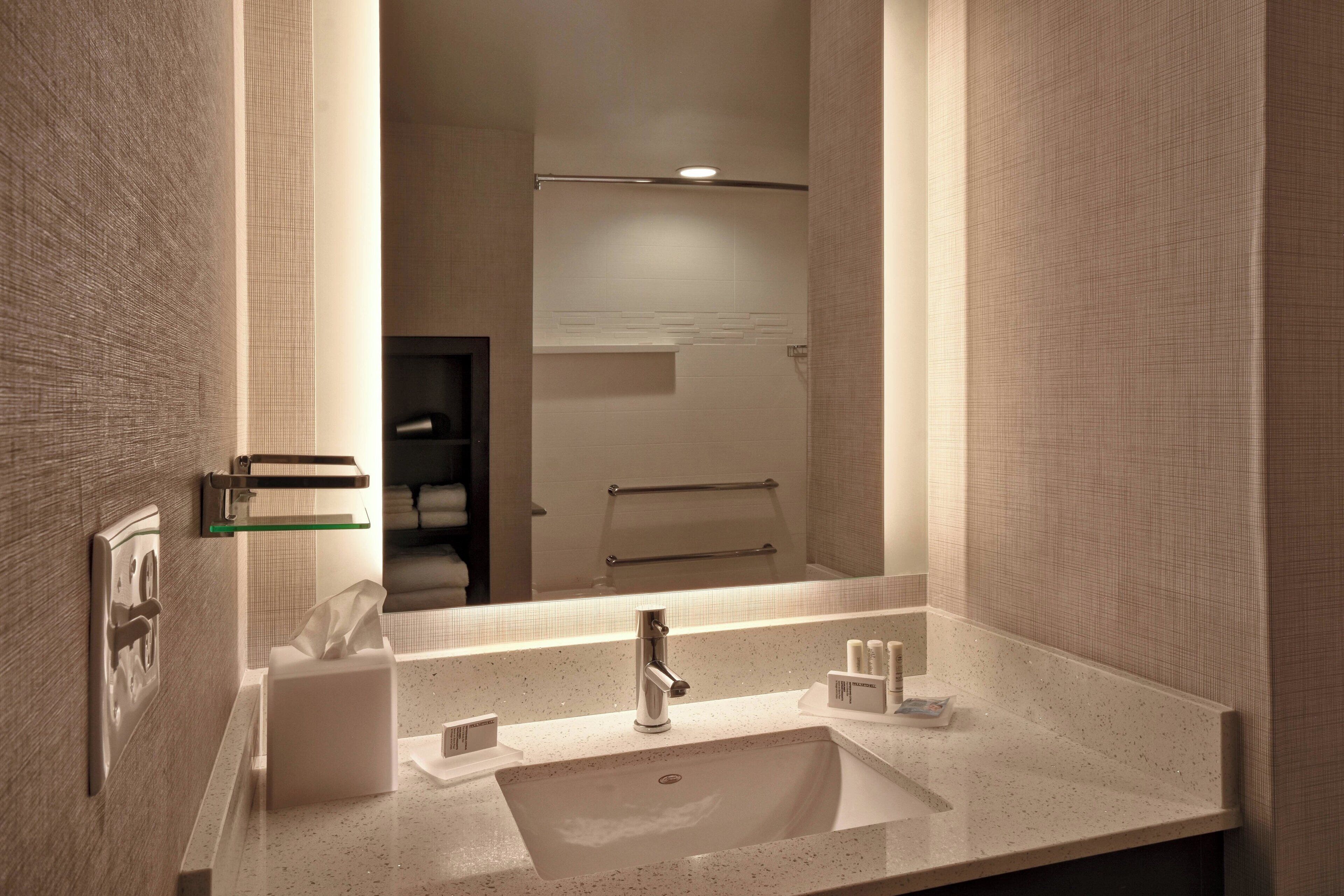 rainfall showerhead, hair dryer, towels, soap