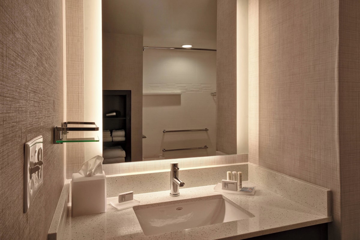 rainfall showerhead, hair dryer, towels, soap