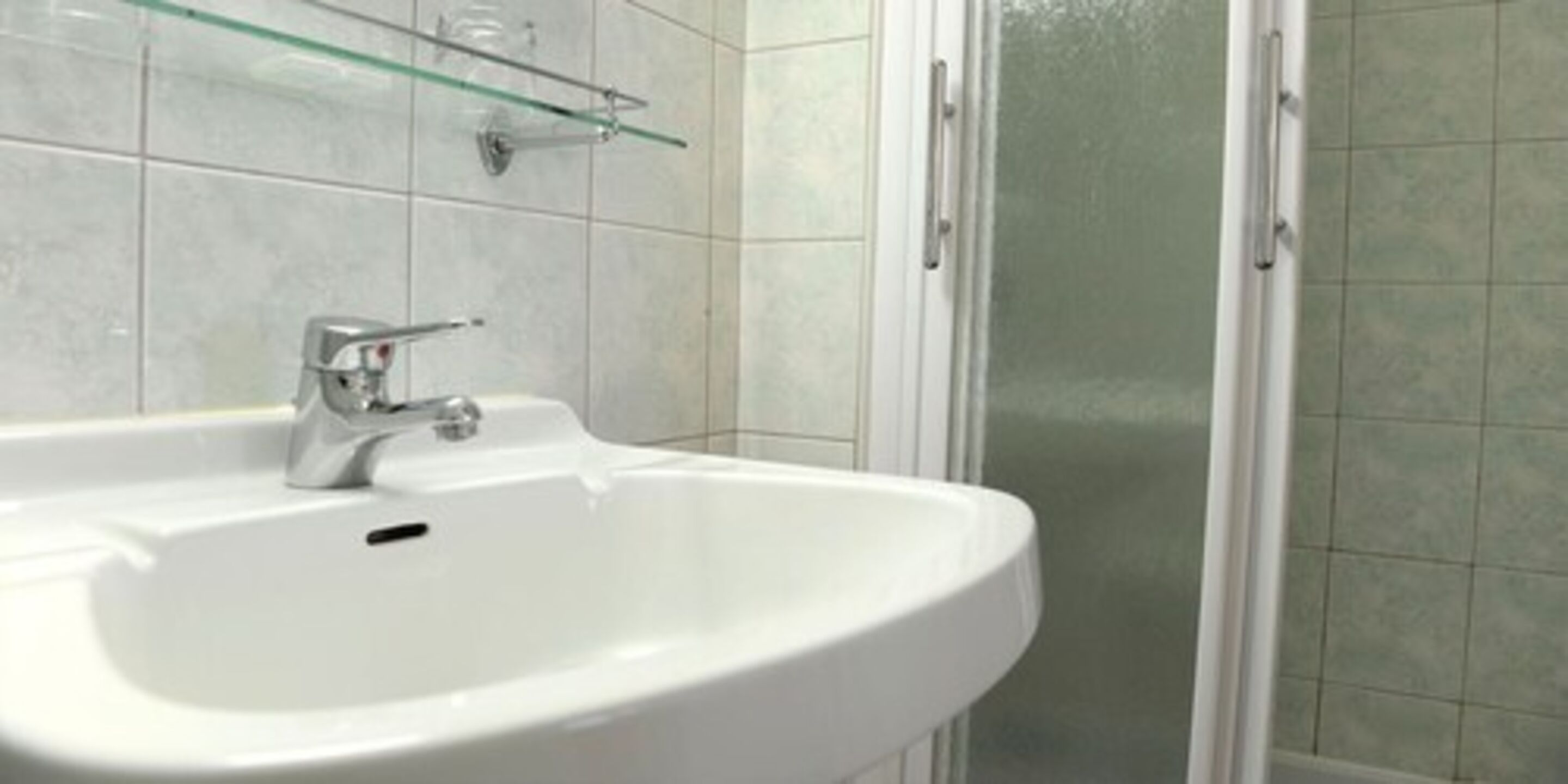 Shower, towels, soap, toilet paper