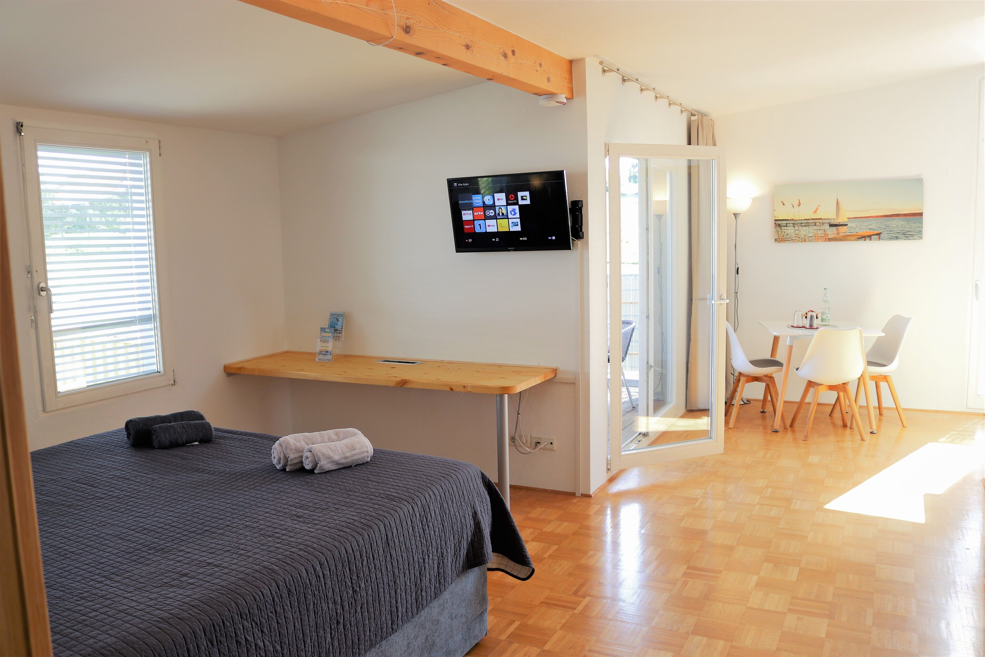 Deluxe Condo | Living area | 90-cm Smart TV with cable channels, TV, pay films