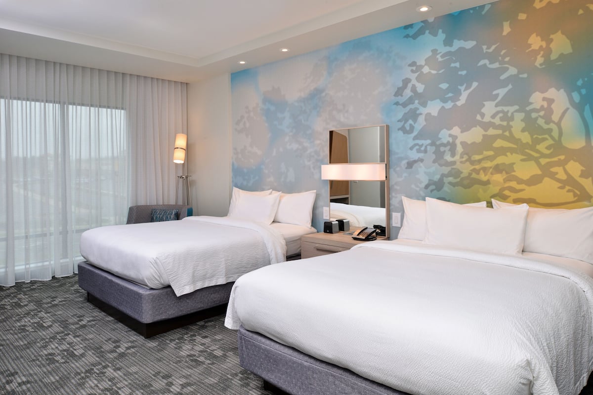 Premium bedding, pillow-top beds, desk, laptop workspace