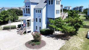 A two-story house with a porch and a small deck. - Oceanside, Private Pool, Close to Beach, Hot Tub! SP2, Blew Bayou (Duck)