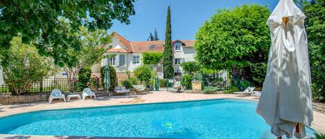Seasonal outdoor pool, pool umbrellas, sun loungers
