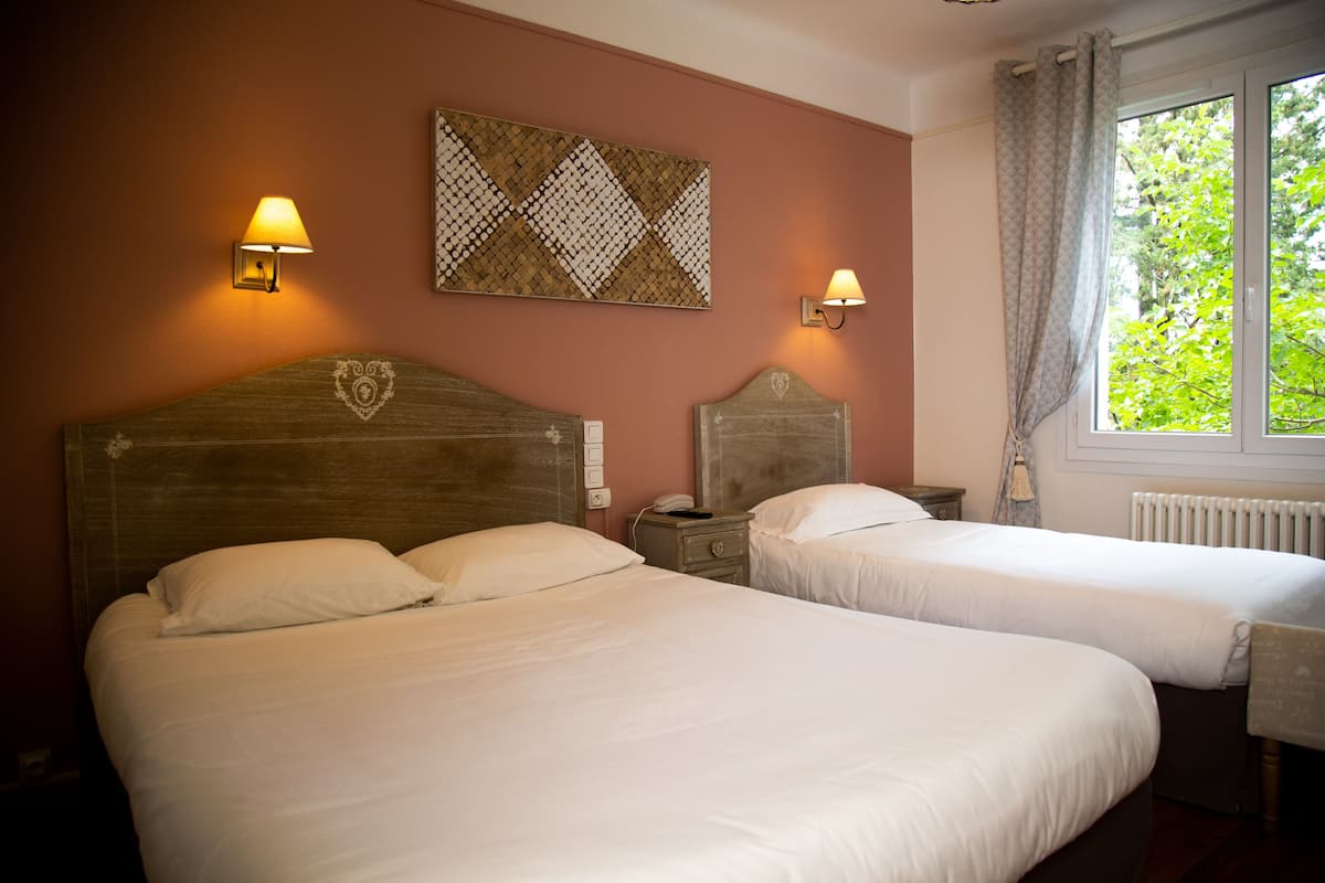 comfort triple room | premium bedding, in-room safe, individually decorated