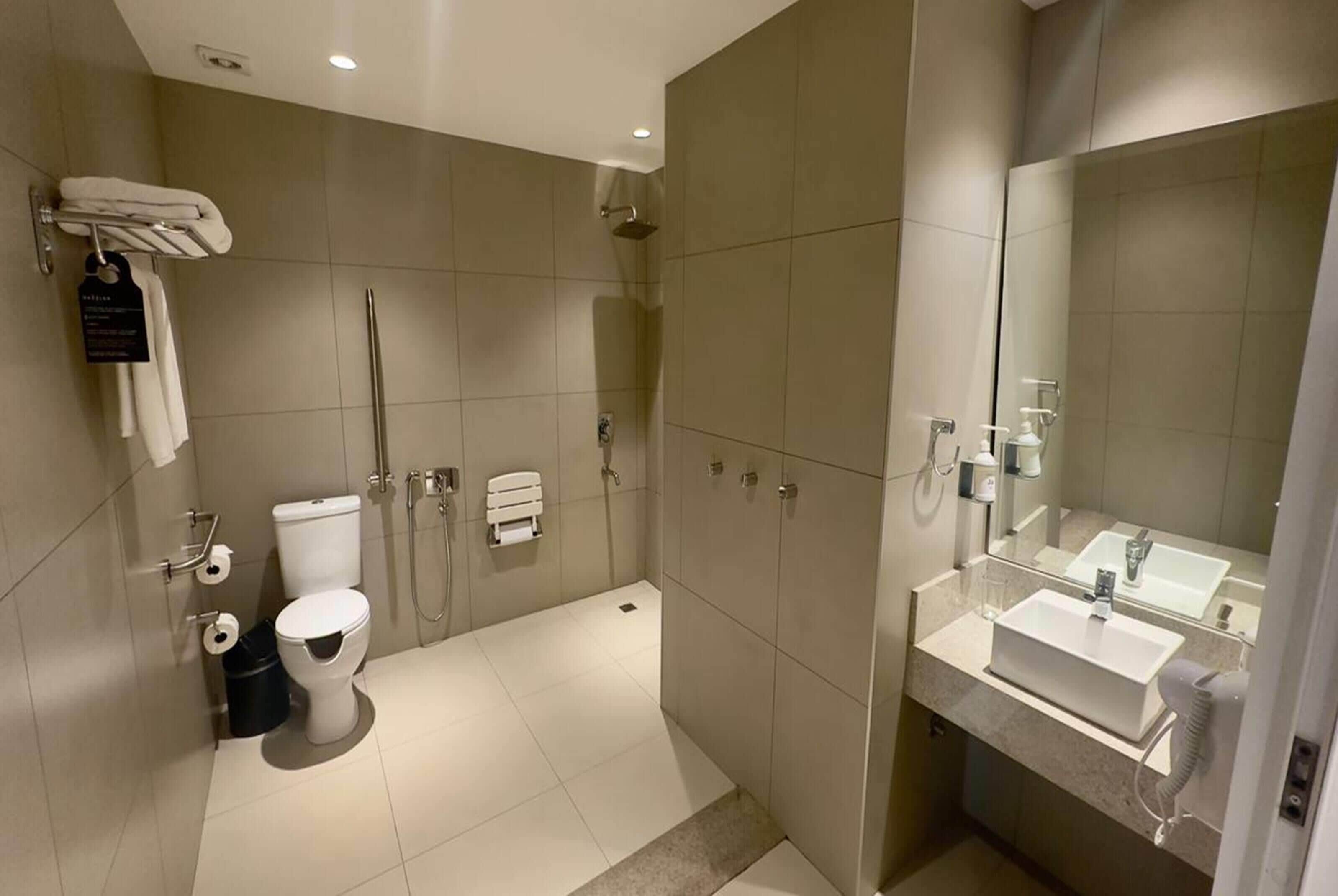 room, 1 king bed, accessible, non smoking | bathroom | rainfall showerhead, hair dryer, towels, soap