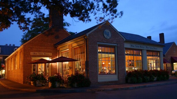 A brick building with a sign reading "Blue Talon Bistro".