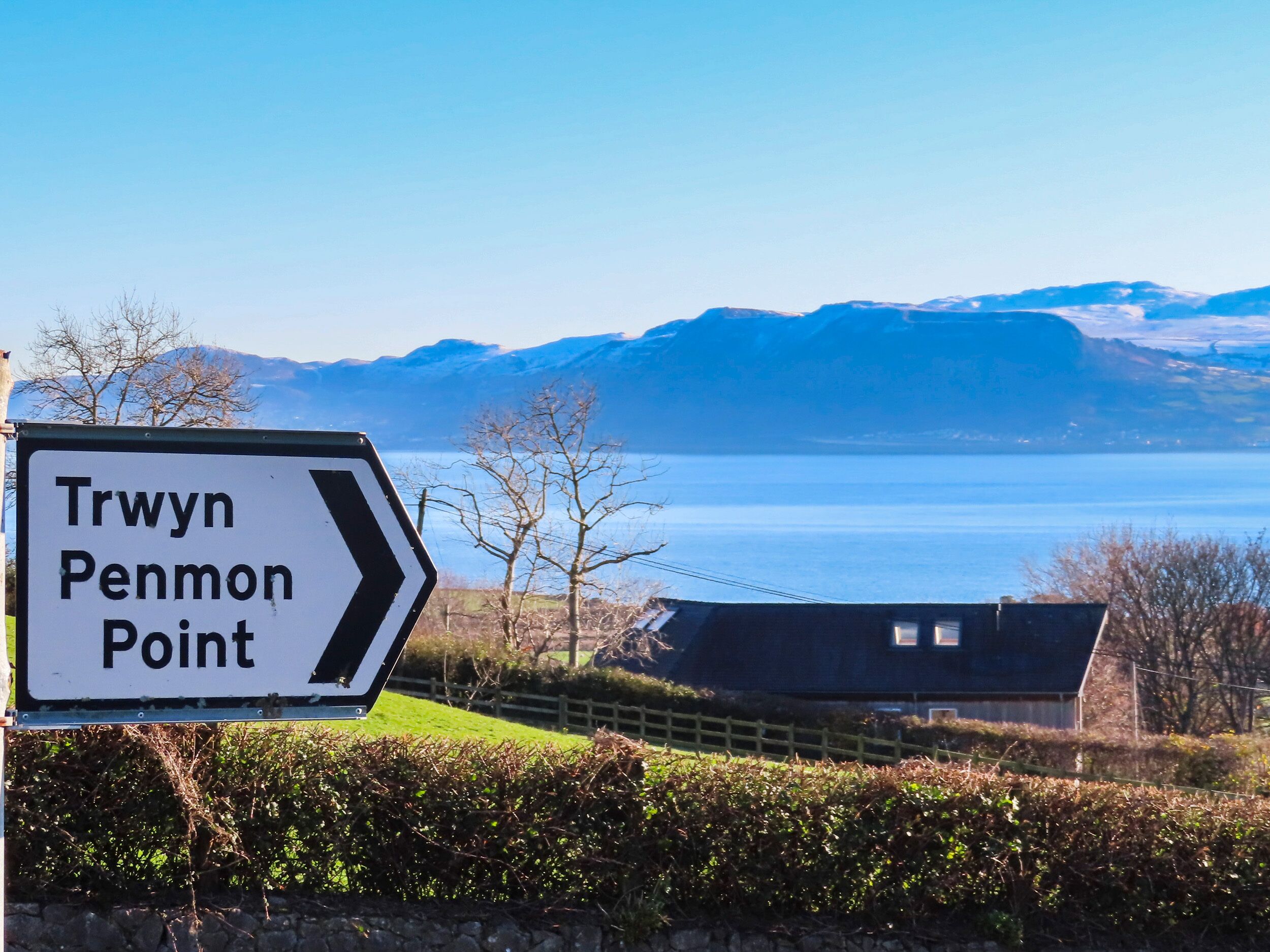 A directional sign for Trwyn Penmon Point.