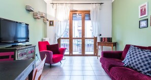 Apartment, 1 Bedroom, Balcony | Living area | TV - JOIVY Cozy Flat for 4 w/ Patio, Nearby Navigli (Milan)