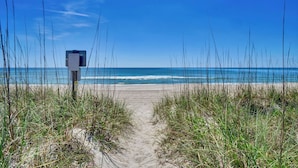 A beach path leading to the ocean with a signpost. -  Siren's Song--Gorgeous Oceanfront House with Pool and Spa! (Kure Beach)