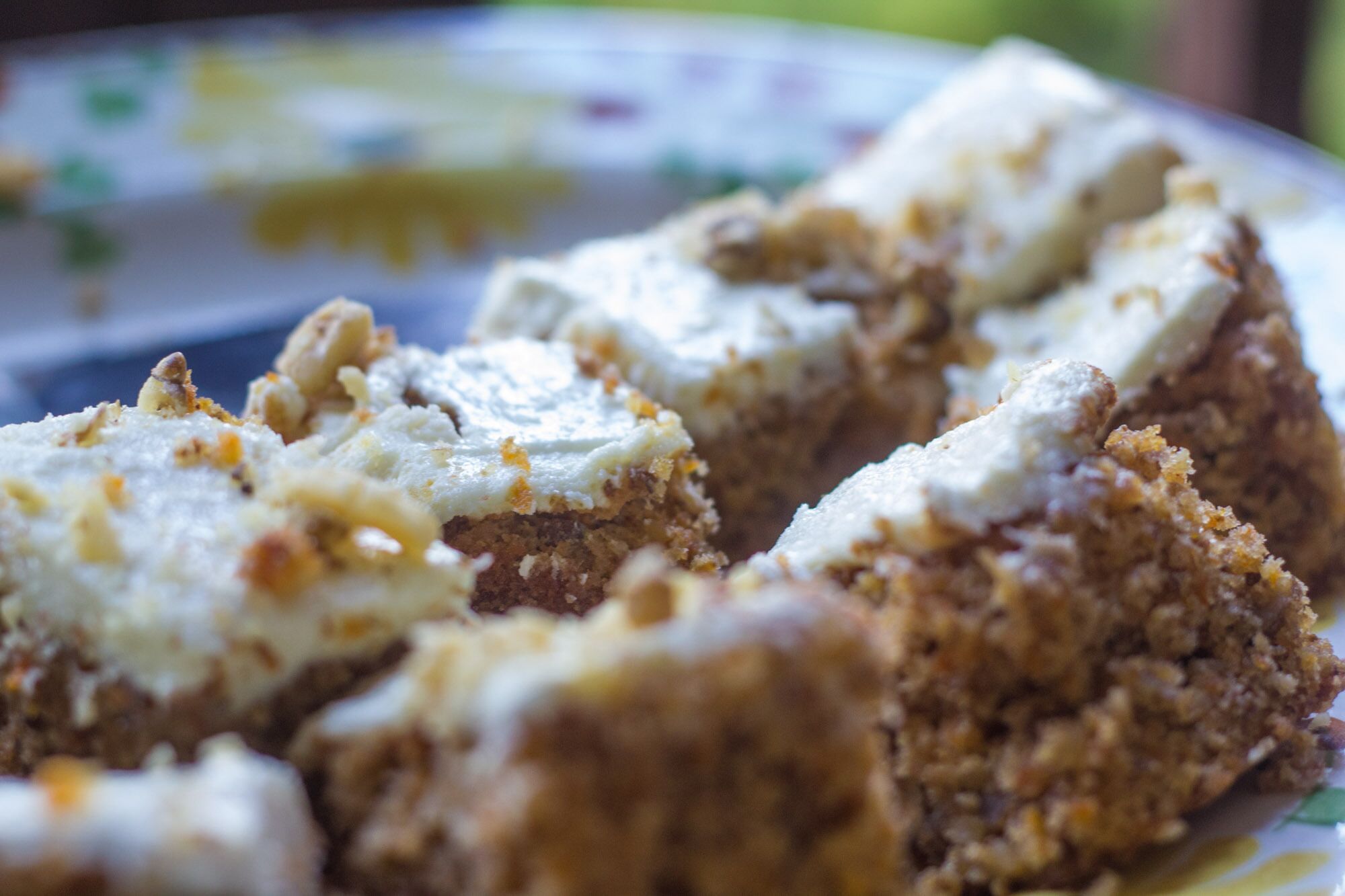 A close-up of a dessert with a crumbly texture and a creamy topping.