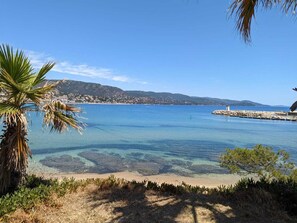 Enjoy breathtaking views of the ocean and surrounding town from this serene beachside location.