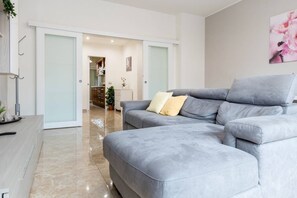 Apartment, 2 Bedrooms, Balcony | Living room | 27-inch TV with digital channels