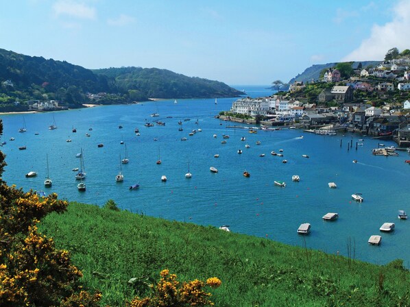 Experience the tranquil coastal town, surrounded by lush greenery and a picturesque harbor.