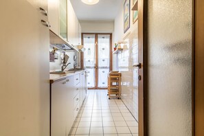 Apartment, 1 Bedroom, Terrace | Private kitchen | Fridge, oven, stovetop, dishwasher - JOIVY Quiet Apt w Terrace in Beautiful Area (Milan)