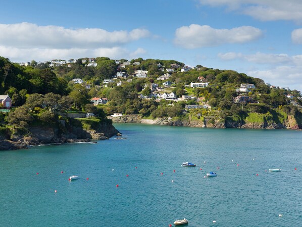 A coastal town with houses on a hillside overlooking a calm sea. - 19 Bolt Head (Salcombe)