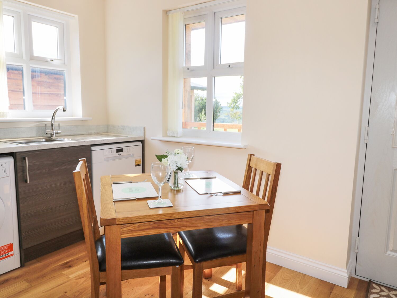 A compact kitchen with a dining area.