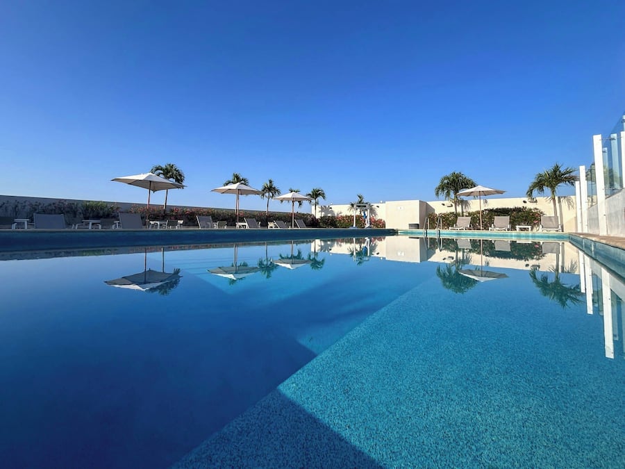 Outdoor pool, open 8:00 AM to 8:00 PM, pool umbrellas, sun loungers