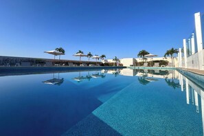 Outdoor pool, open 8:00 AM to 8:00 PM, pool umbrellas, sun loungers
