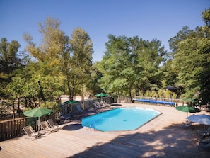 Seasonal outdoor pool, a heated pool, pool umbrellas, pool loungers